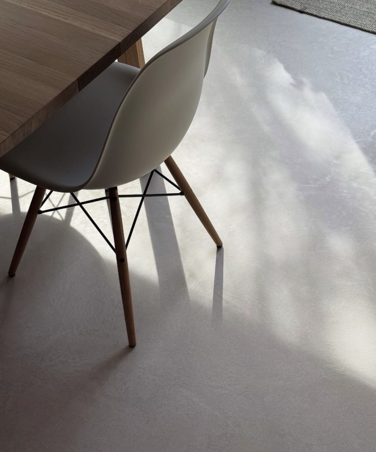 Power-floated concrete floor catching soft daylight